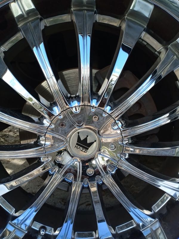 Polished chrome rim in the sun
